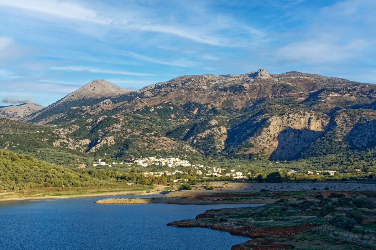 Mountain landscape with a small village and reservoir in Crete, Greece – rural scenery and natural environment in the Cretan countryside