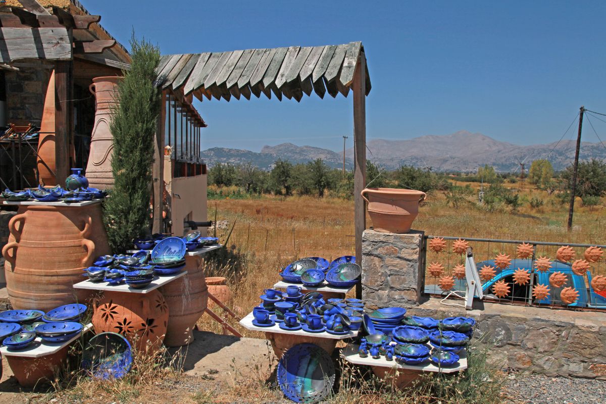 Traditional Cretan pottery and ceramics displayed outdoors at a local workshop in rural Crete, Greece – handmade crafts and local art