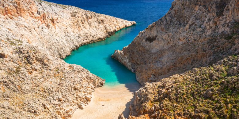Seitan Limania Beach in Crete with turquoise waters and rocky cliffs during summer.