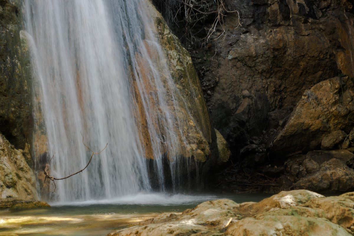Waterfall cascading over rocks in Mylonas Gorge Crete.