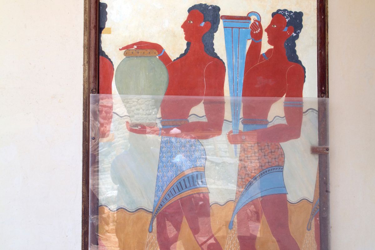 Minoan fresco from Knossos Palace in Crete showing figures carrying vessels.