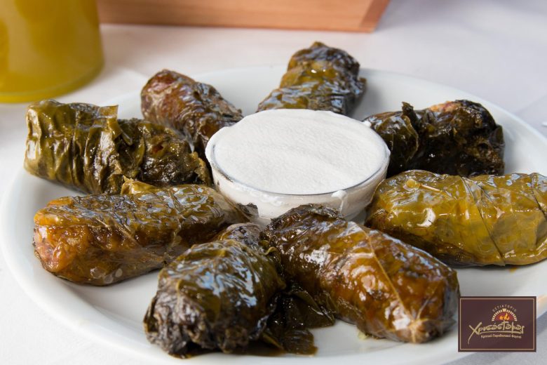 Dolmadakia: traditional wine leaves stuffed with rice and herbs accompanied by yogurt at Chrisostomos Restaurant