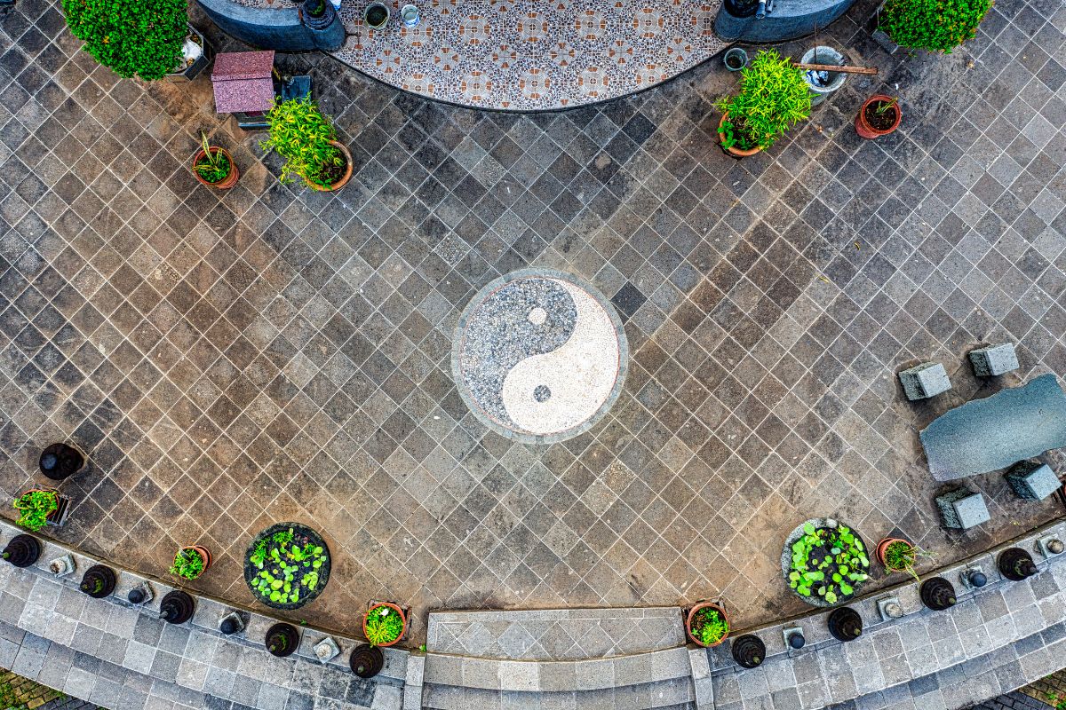 Aerial view of a yin og yang symbol in a traditional stone courtyard.