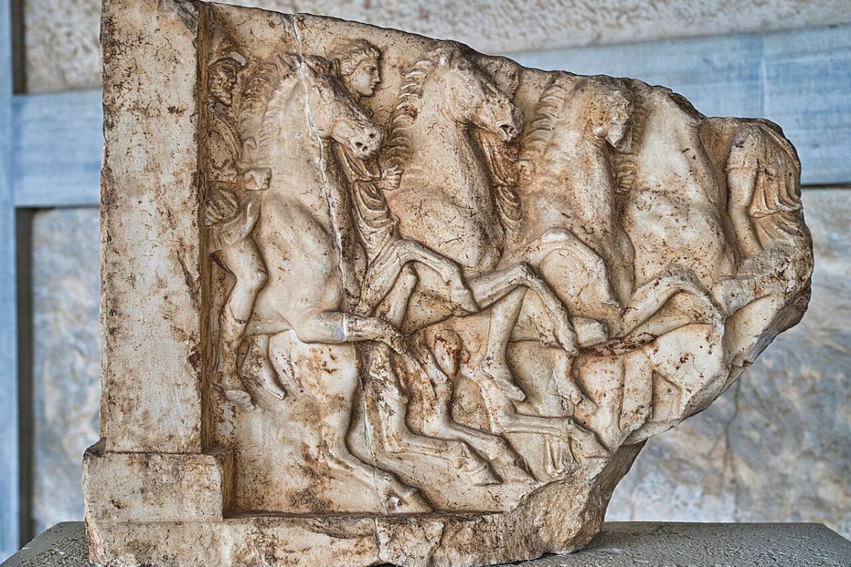 Fragment of an ancient Greek dedicatory relief for a victory of the tribe Leontis in Antippasia, displayed at the Ancient Agora Museum in Athens.