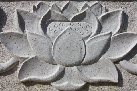 A captivating bas-relief sculpture of a lotus flower.