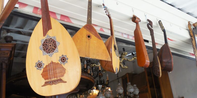 Various traditional Greek string instruments hanging outside a shop.