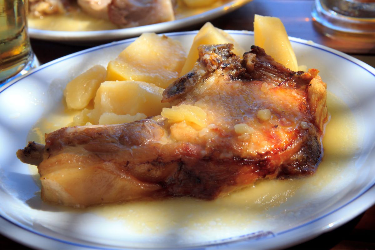 Traditional Cretan dish of roasted meat with lemon potatoes, a classic example of Cretan cuisine.