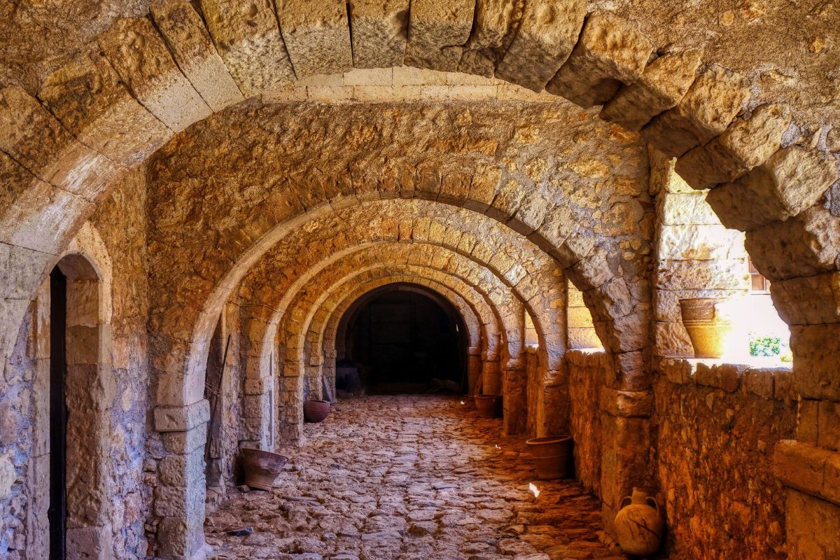 Stone archway at Arkadi Monastery in Crete, a historic Crete to do for culture and architecture enthusiasts.