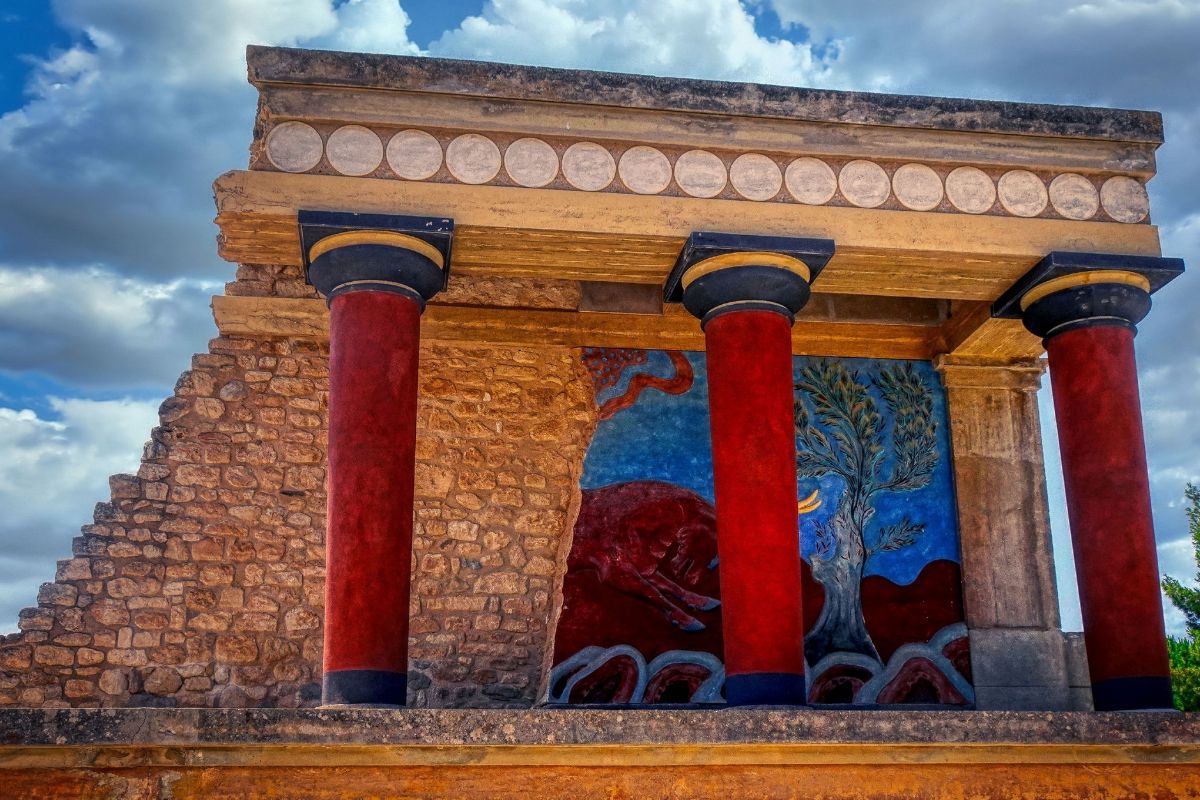 Colorful ruins of the Palace of Knossos in Crete, a must-see Crete to do for history and archaeology lovers.