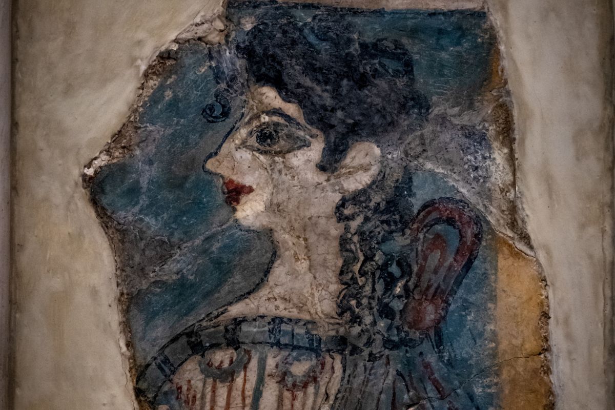Minoan fresco of a woman from ancient Crete, showing early Greek art and culture.