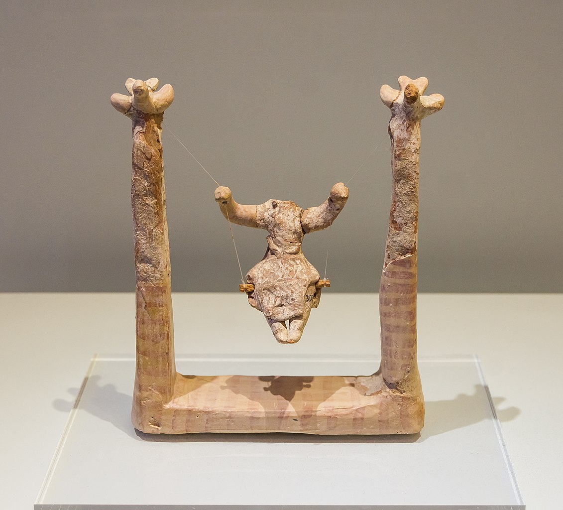 Archaeological Museum in Heraklion, Crete, Greece. Woman sitting on a swing. Agia Triada, Late New Palace period ( 1450-1300 B.C.E )
