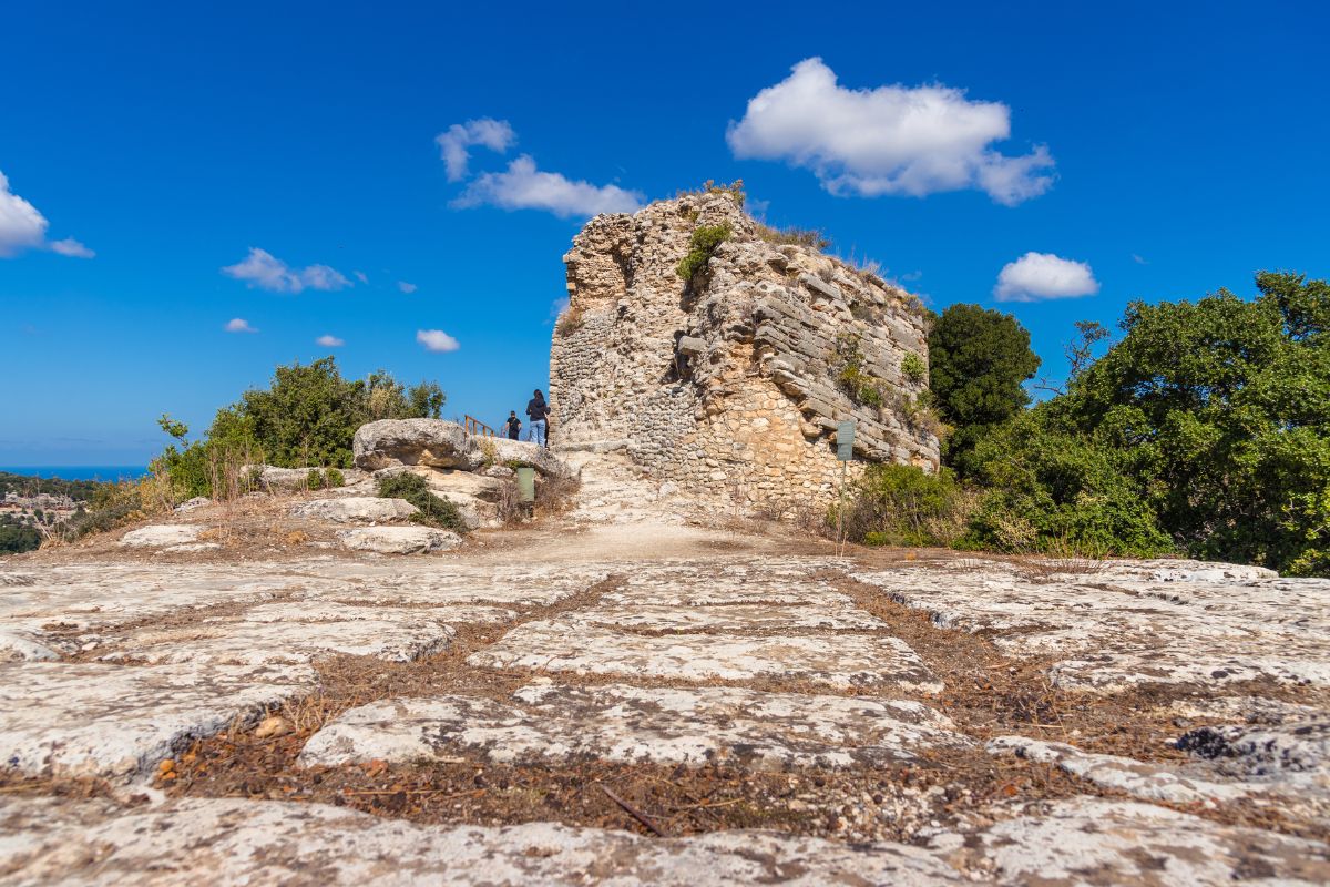 Ancient ruins of Eleftherna in Crete, Greece, located on a hilltop with panoramic views of the surrounding landscape