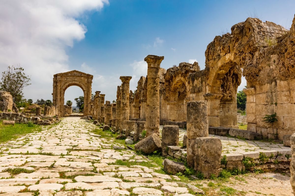 Ancient ruins and stone archway at the Kastelli archaeological site in Crete, Greece, showcasing historic remains from the island’s past.