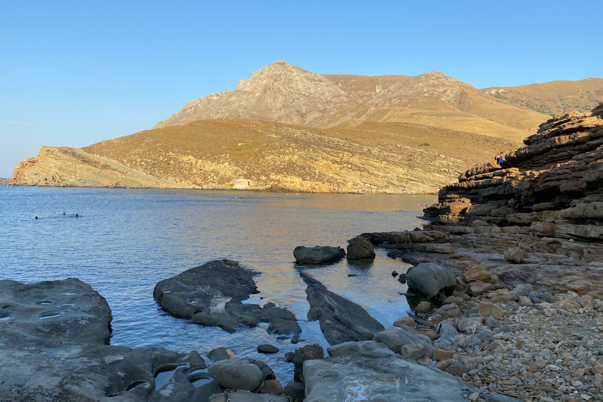 Rocky coastline and calm sea near Sfakia in Crete, a popular swimming stop after hiking Imbros Gorge.