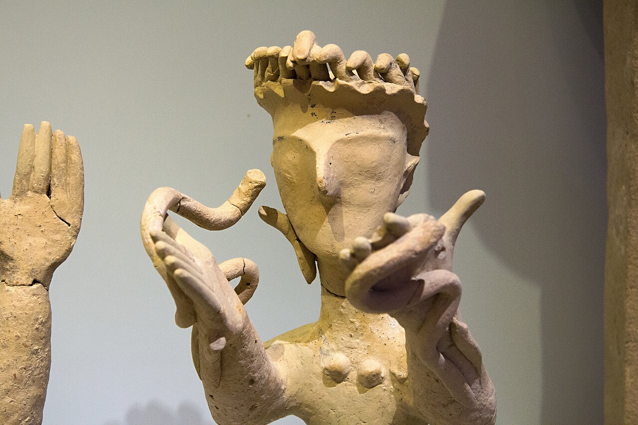 Minoan goddess with upraised arms and snakes, terracotta figurine, Archaeological Museum of Heraklion.