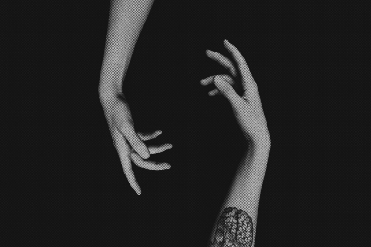 Black-and-white image of two hands reaching toward each other, symbolizing divine masculine and feminine energy beyond gender roles.