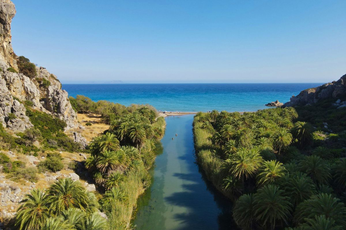 Preveli Beach Crete palm forest and freshwater river flowing into the Libyan Sea.