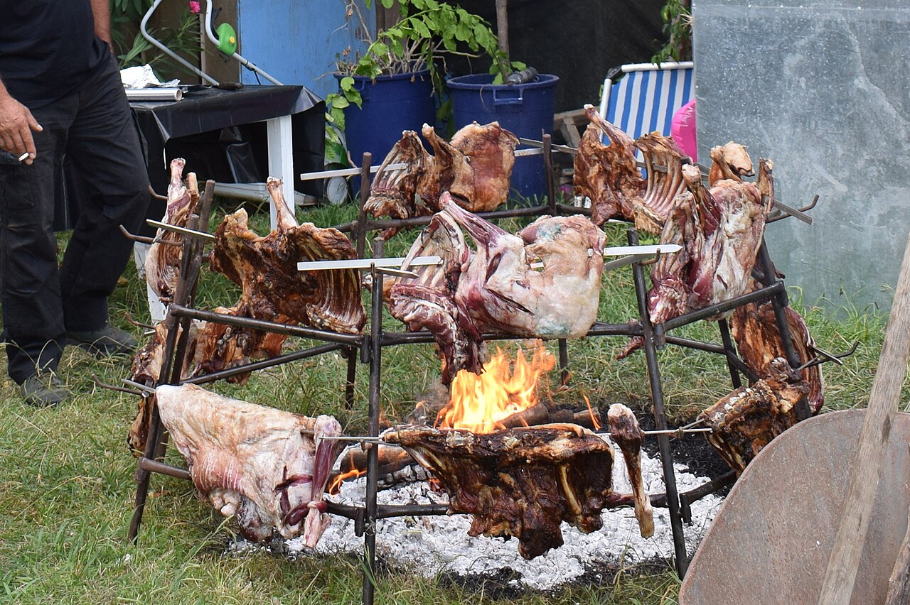 Traditional Cretan antikristo meat roasting around an open fire