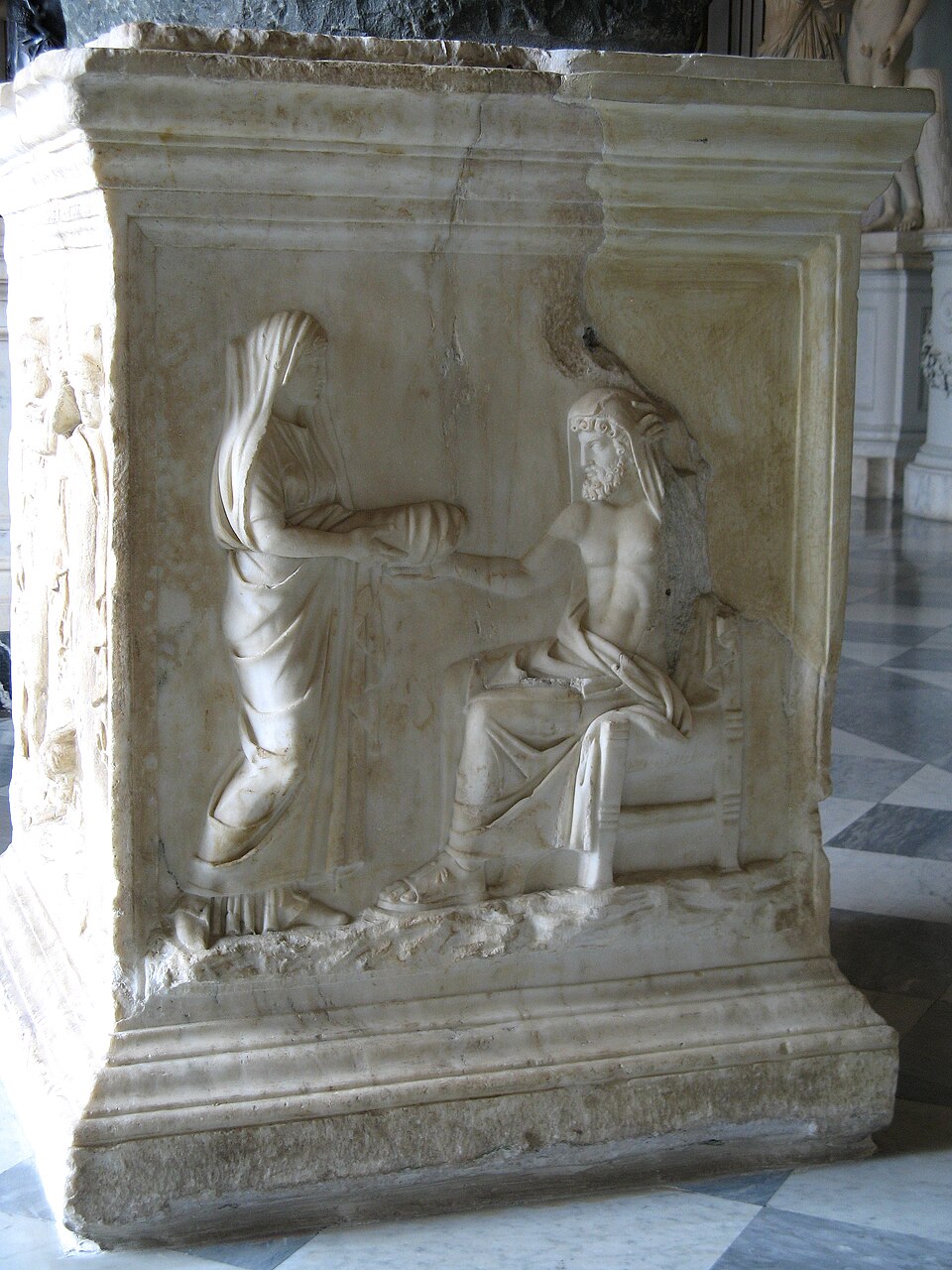 Roman marble relief of Rhea giving Kronos a swaddled stone at the birth of Zeus